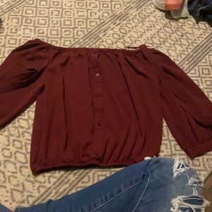 a burgundy half sleeved crop top